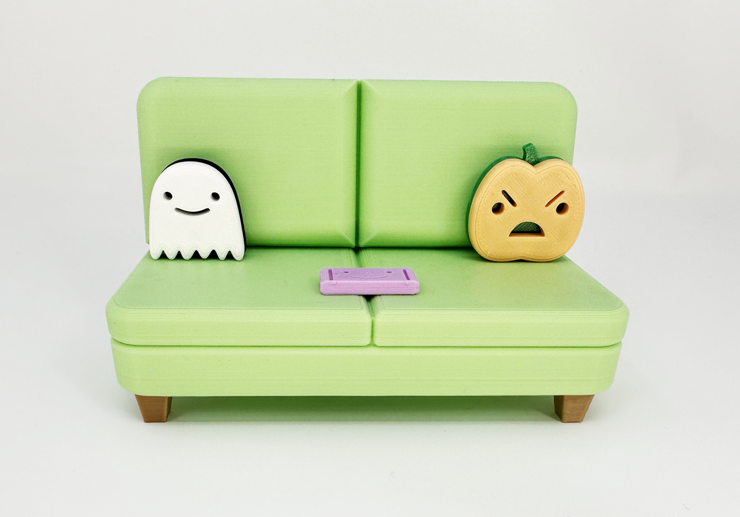 The Halloween Colab Couch Phone Holder with Candy Bar and Ghost + Pumpkin Pillows