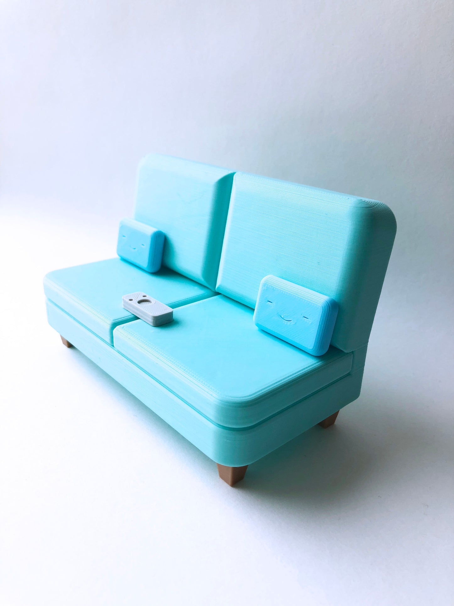 The Colab Couch Phone Holder with Remote and Pillows