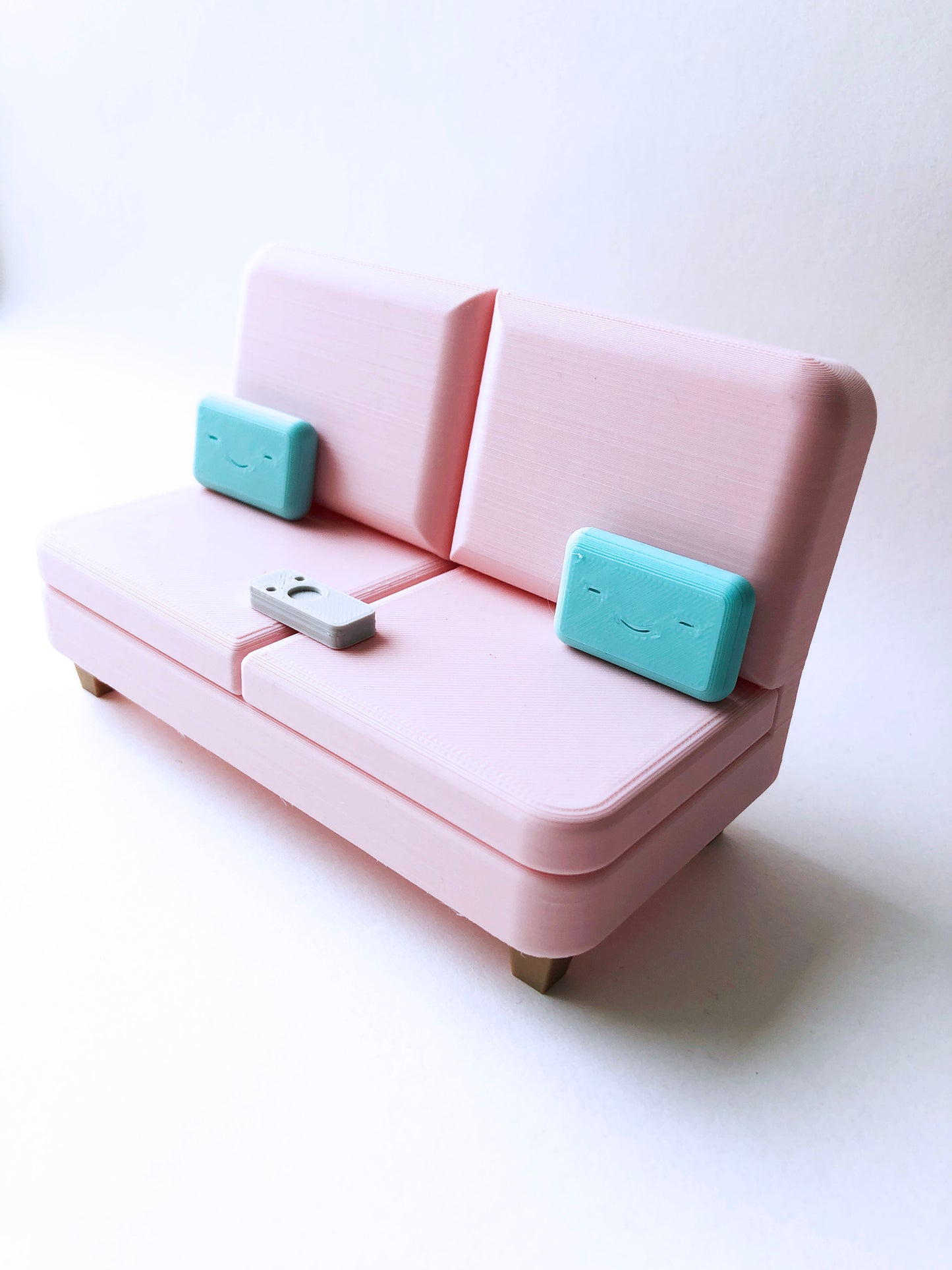 The Colab Couch Phone Holder with Remote and Pillows