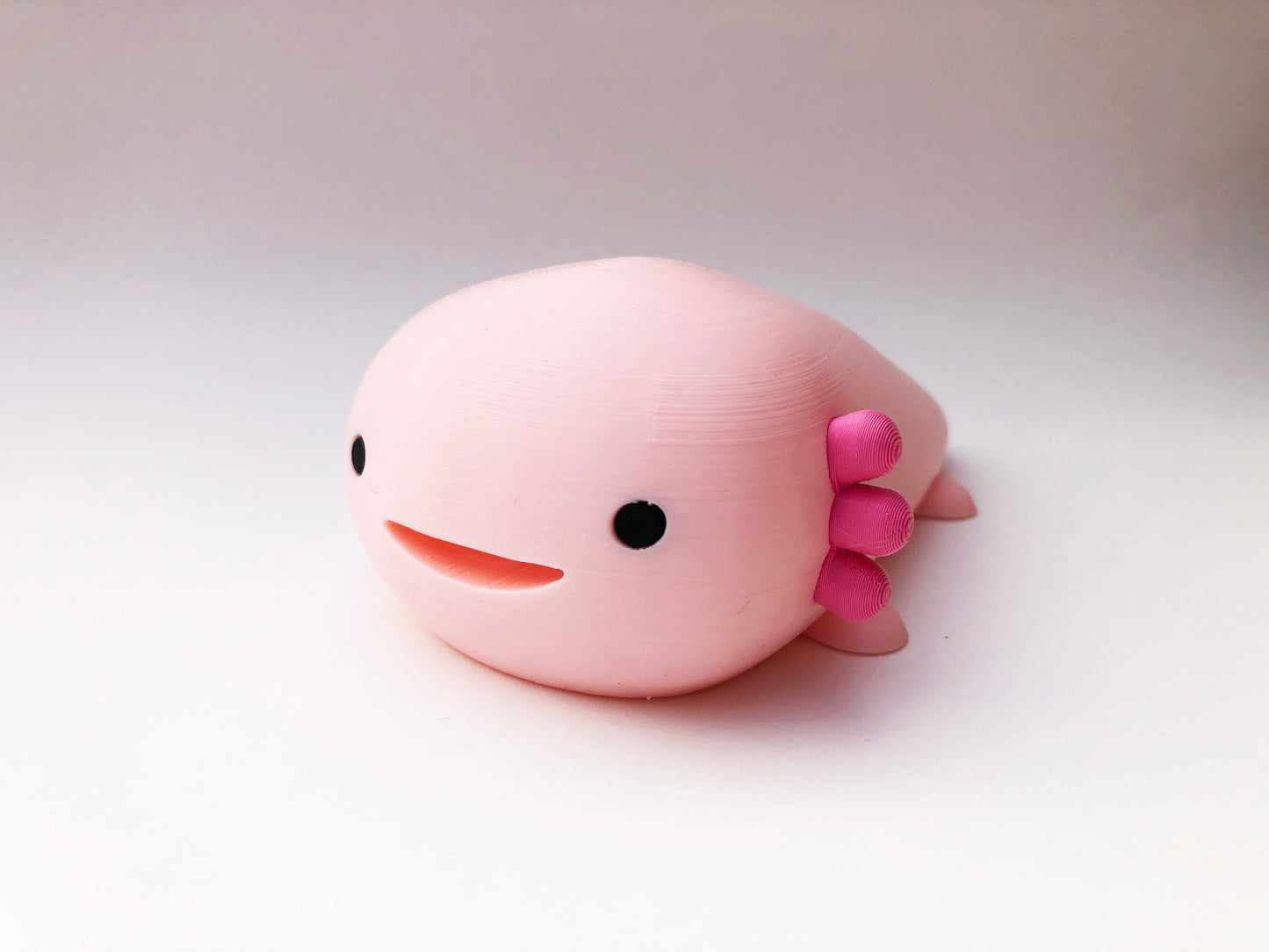 Ruby the Axolotl, the secret keeper in Strawberry Milk Pink