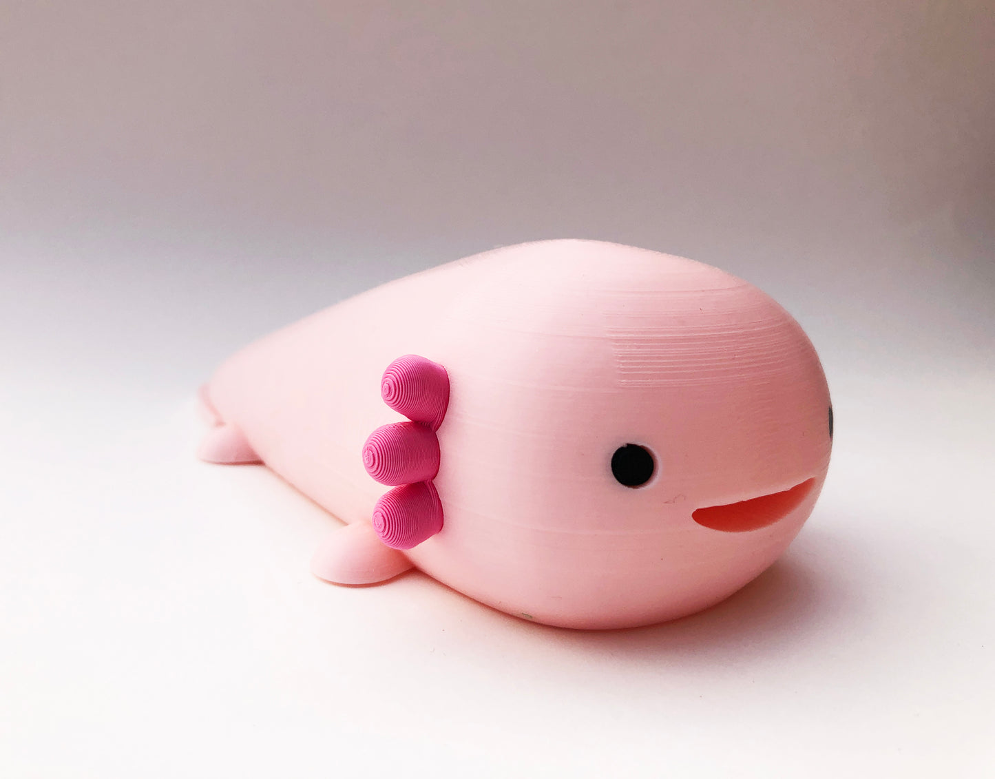 Ruby the Axolotl, the secret keeper in Strawberry Milk Pink