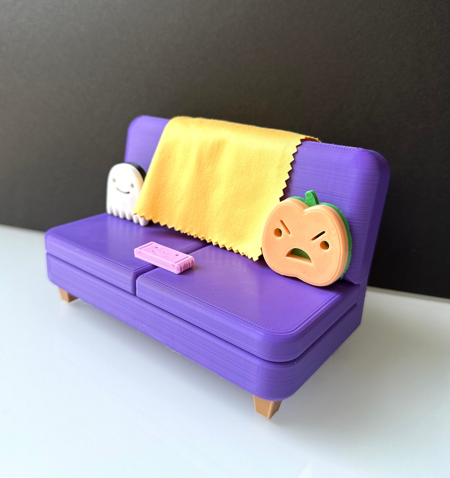 The Halloween Colab Couch Phone Holder with Candy Bar and Ghost + Pumpkin Pillows